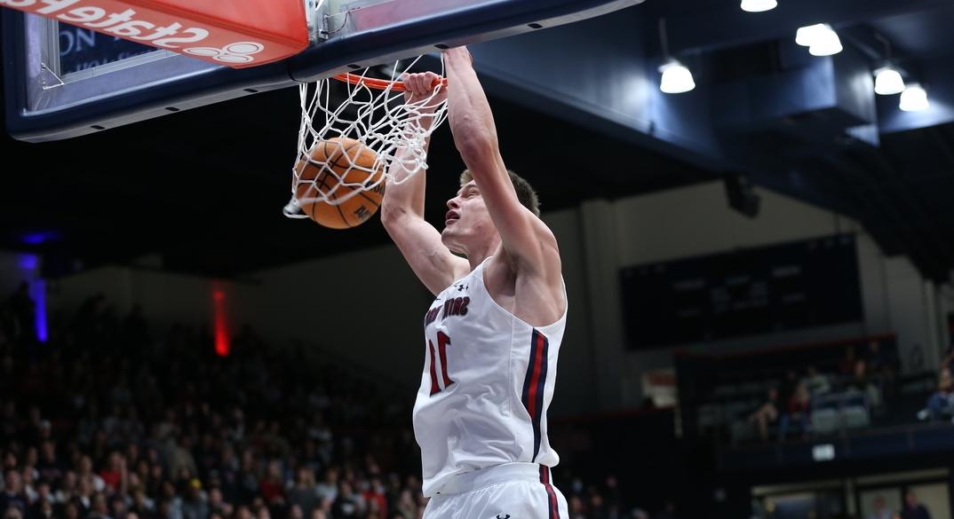 A Saint Mary's basketball player dunking