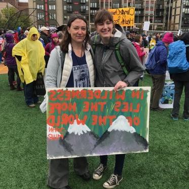 EES student with Faculty member at a climate rally
